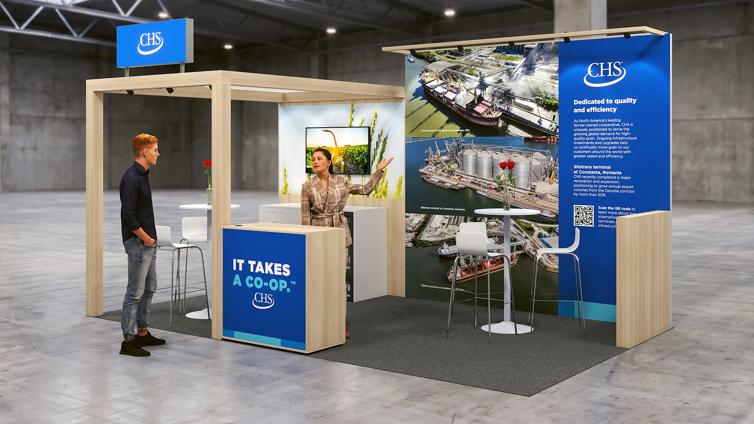 CHS stand with an open portal, a blue print wall with a screen and a counter with the logo